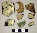 Metal fragments, gold plated, very corroded