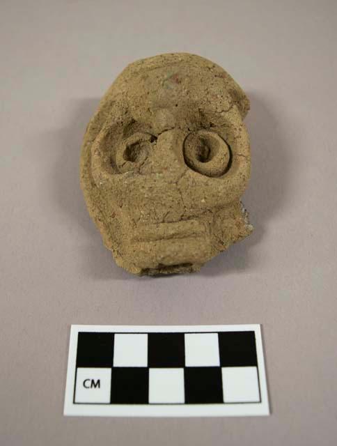 Effigy head - owl face (?) - originally on pottery vessel