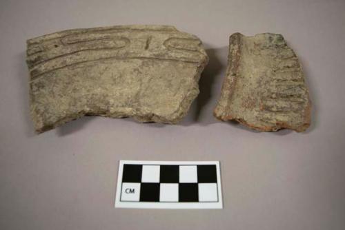 2 rim potsherds with incised decoration