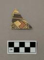 Ceramic, sherd, flat, curved edge, polychrome, designs one side