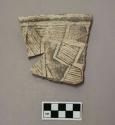 Restored rim sherd--crackle black-on-white