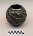 Carved black ceramic bowl:  avanyu motif