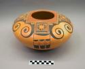Polychrome-on-reddish brown bowl: double swirls and geometric motifs