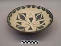 Red and black-on-buff bowl: floral motif