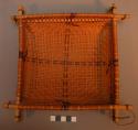 Basketry strainer, square, double wooden rim, woven cross design.