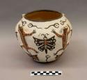 Polychrome-on-white olla with frogs:  animal motif