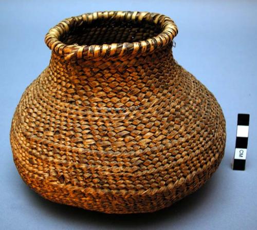 Small utility basket, twined (uncoated water bottle?).  Made of bear grass.