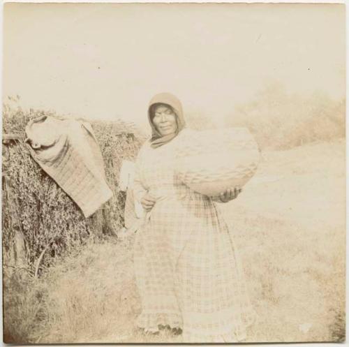 Molly, holding a large basket