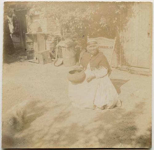 Woman sitting, with basket