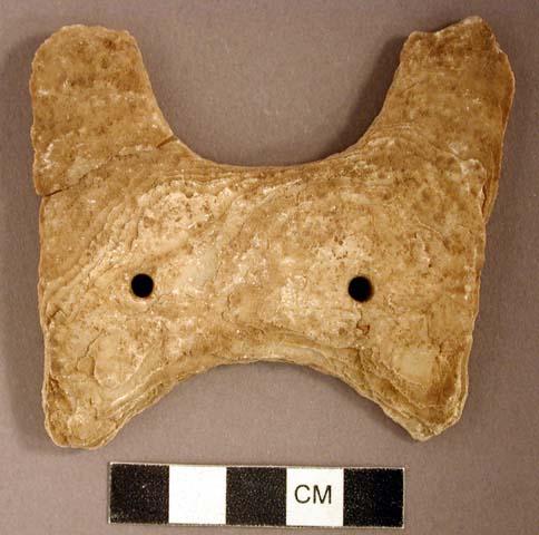 Ground stone gorget, two perforated holes