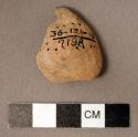 Fragment of crude pottery vessel with small parallel rows of small perforations