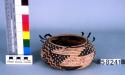 Basketry bowl with black stepped design.