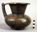 Black pottery jar with spout