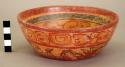 Ceramic bowl, polychrome, heavily decorated, flat base, flaring sides