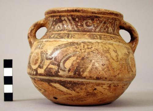 Two-handled Yojoa polychrome pottery pot, bold anamalistic style.