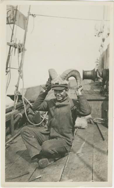 Arctic Voyage of Schooner Polar Bear - Ivan Klepnekoff holding mountain goat horns on head