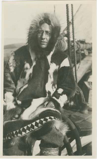 Arctic Voyage of Schooner Polar Bear - Man in fur coat sitting on deck