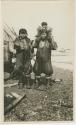 Arctic Voyage of Schooner Polar Bear - Two woman, one with child on her shoulders