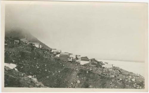 Arctic Voyage of Schooner Polar Bear - View of village on rocky embankment