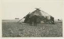 Arctic Voyage of Schooner Polar Bear - Two men outside hut