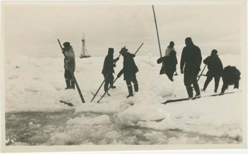 Arctic Voyage of Schooner Polar Bear - Crew cutting the ice