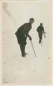 Arctic Voyage of Schooner Polar Bear - Man standing in snow with stick