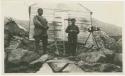 Arctic Voyage of Schooner Polar Bear - Two men standing outside wooden building
