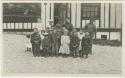 Arctic Voyage of Schooner Polar Bear - Group photograph with children in Atka