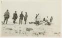 Arctic Voyage of Schooner Polar Bear - Crew standing next to sled