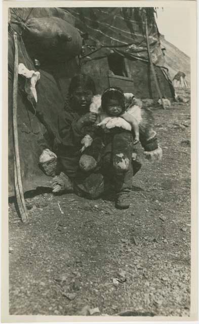 Arctic Voyage of Schooner Polar Bear - Woman in fur coat holding child