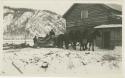 Arctic Voyage of Schooner Polar Bear - Horses pulling logs next to cabin