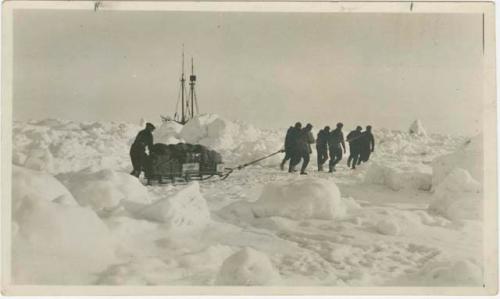 Arctic Voyage of Schooner Polar Bear - Crew hauling sled through ice and snow