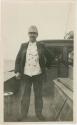 Arctic Voyage of Schooner Polar Bear - Man in hat standing on deck