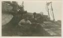 Arctic Voyage of Schooner Polar Bear - Two men with walrus pup