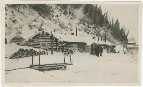 Arctic Voyage of Schooner Polar Bear - Log cabin covered in snow