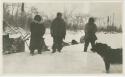 Arctic Voyage of Schooner Polar Bear - Three men and dog standing in snow