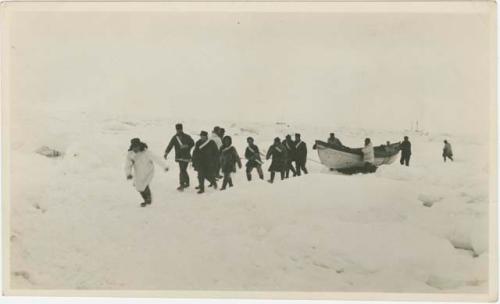 Arctic Voyage of Schooner Polar Bear - Crew pushing small boat over ice