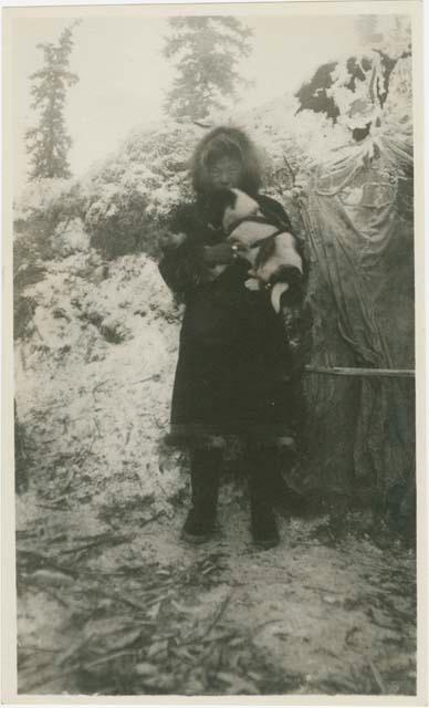 Arctic Voyage of Schooner Polar Bear - Person in fur coat holding puppy