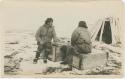 Arctic Voyage of Schooner Polar Bear - Two men sitting on crates, one smoking a pipe