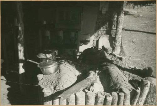 Stove of logs and adobe