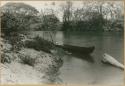 Person laying in river canoe