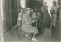 Eleanor Lothrop, Mrs. Karl Curtis, Juan Gratacos, and Don Carlos sitting around a table