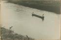 Two men in canoe on a river