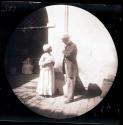 Man and woman standing under archway