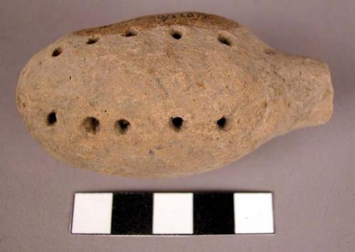 Hollow clay object with rows of perforations-rattle?