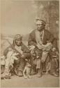 Studio portrait of Kiasi and Naiiuhtchi, during their visit to Boston with F. H. Cushing. Both individuals are bow priests.