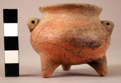 Very small tripod pottery vessel with two handles