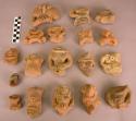 18 pottery body effigy parts (heads and torsos)