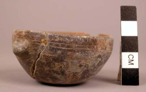 Fine incised black-brown ware small vessel