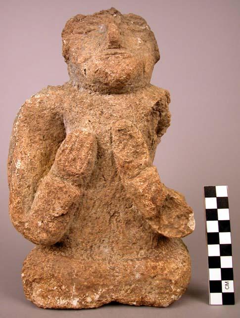 Human figure sculptured in stone